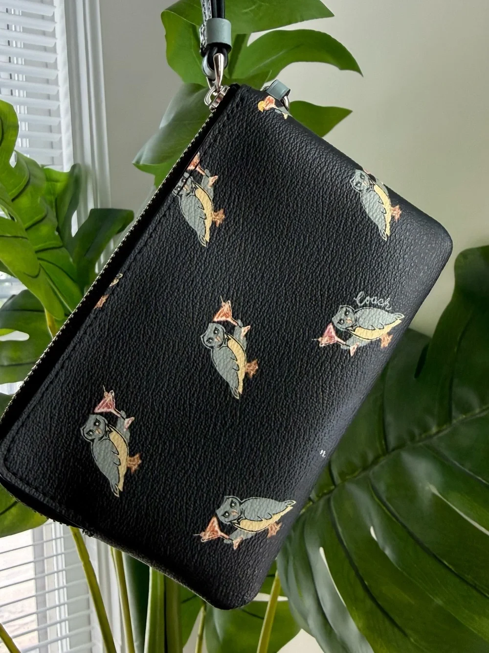 Coach Black Leather Wristlet with Multicolor Bird Motif